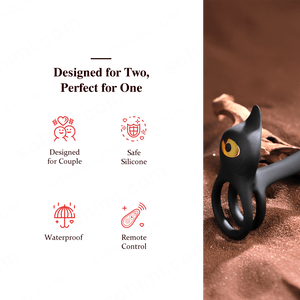 Black cat-shaped silicone ring with yellow eye on a brown background,