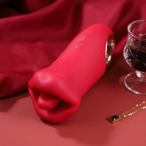Red silicone product on a red fabric background with a glass of red wine and necklace.