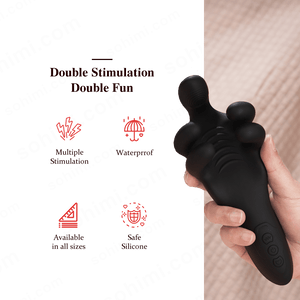 Black double-stimulation device held by a hand with promotional text on a green background.