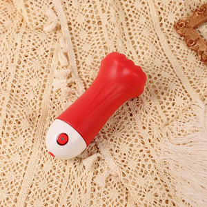 Red and white object on a textured beige surface