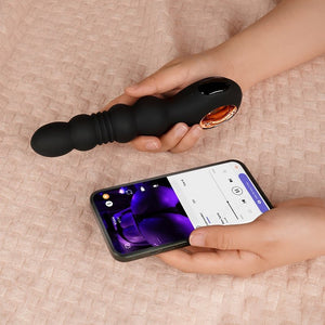 a hand hold a anal vibrator and a phone