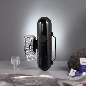 Black lectronic device on a gray surface with a gray background