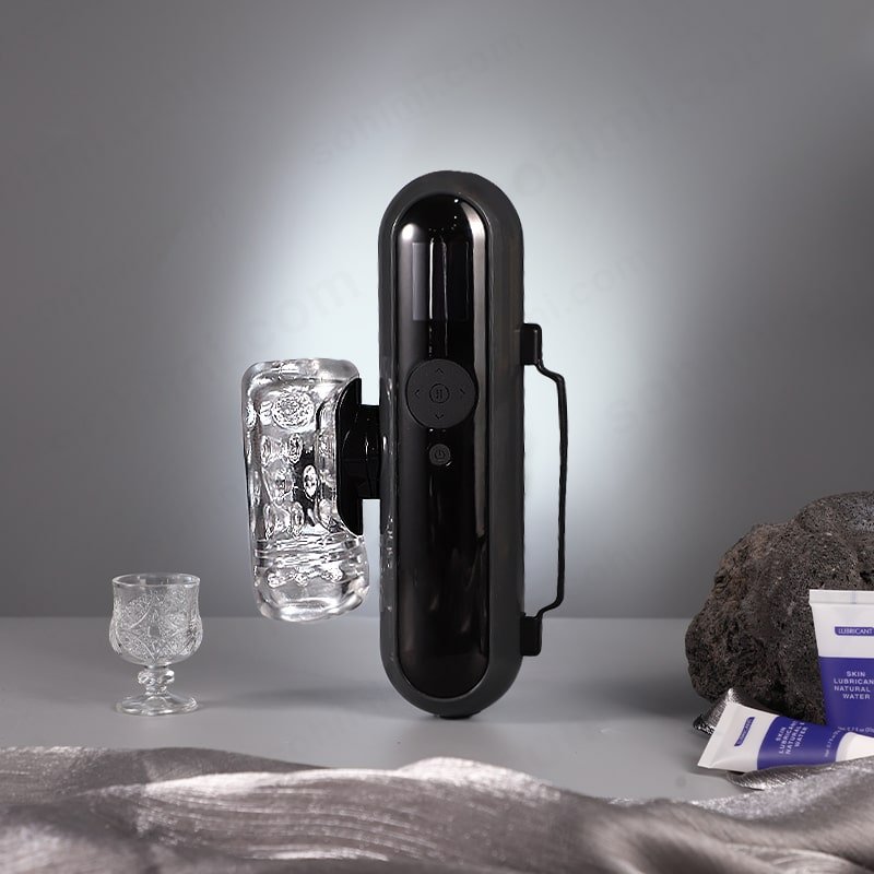 Black lectronic device on a gray surface with a gray background