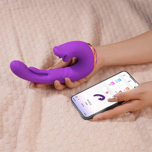Purple silicone product held by a hand with a smartphone displaying an app on a beige surface