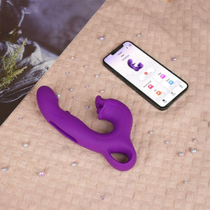 A Clit and G-spot vibrator on a blanket and a phone on it.