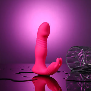 Pink female rabbit vibe on a reflective surface with a purple background