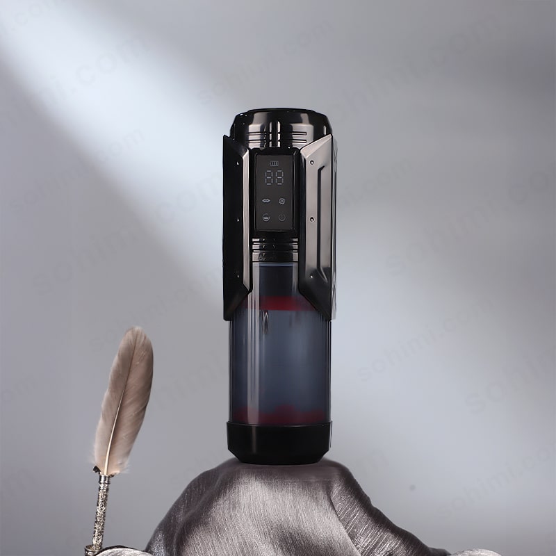 Black electronic device with digital display on a gray background