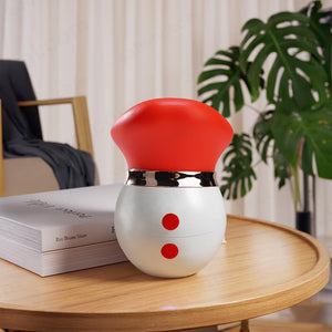 Red and white tongue toy on a desk