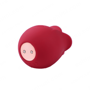 Red plush toy with a pink face on a green background with 'sohimi.com' text.