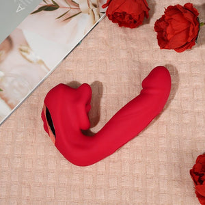 A female G-spot vibrator on a blanket with a book and some flowers